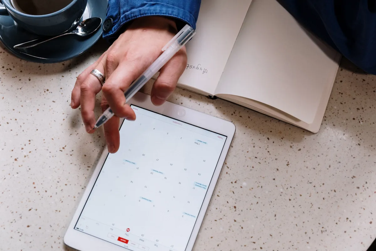 A husband checks his shared calendar to see what is going on today