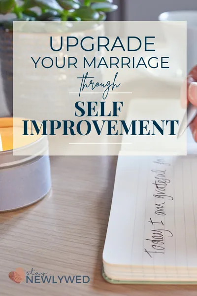 An open journal with a person writing a gratitude list