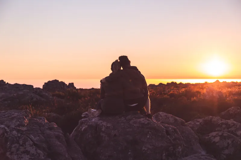 Couple spending quality time together watching a sunset