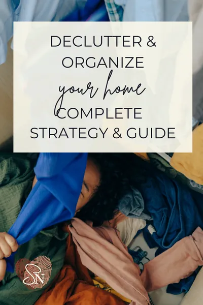 Woman laying on the ground of her messy closet